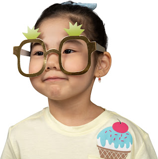 A little girl wearing glasses